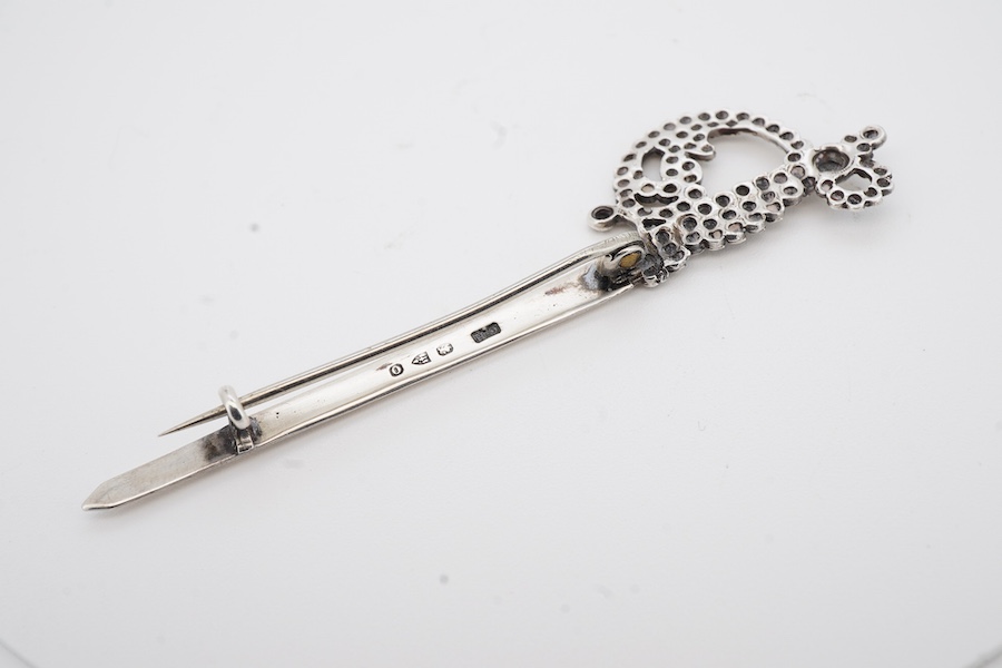 A late Victorian silver brooch by Charles Horner, modelled as a sword, Chester, 1897, 77mm.